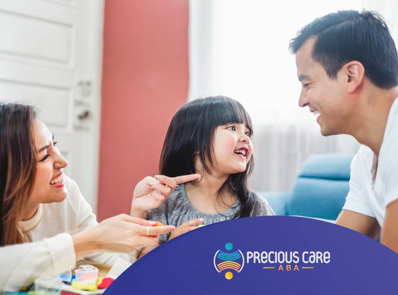 A family is enjoying playdough fun together after ABA therapy session.