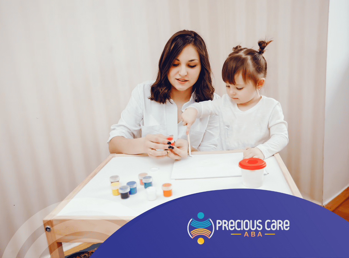 A girl with autism and an RBT during ABA therapy