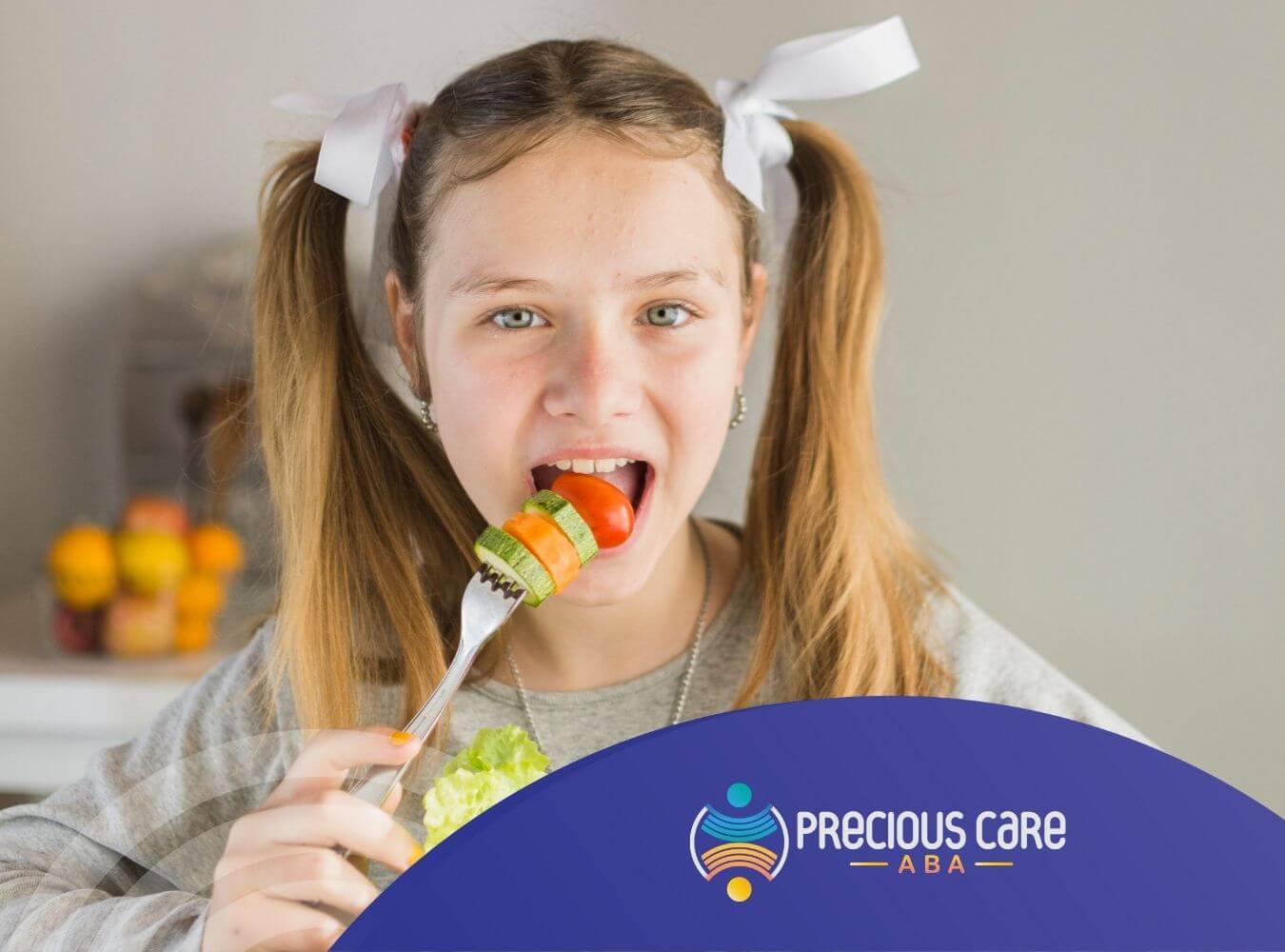 A girl with autism is happily eating a colorful vegetable salad on a fork before ABA therapy starts.