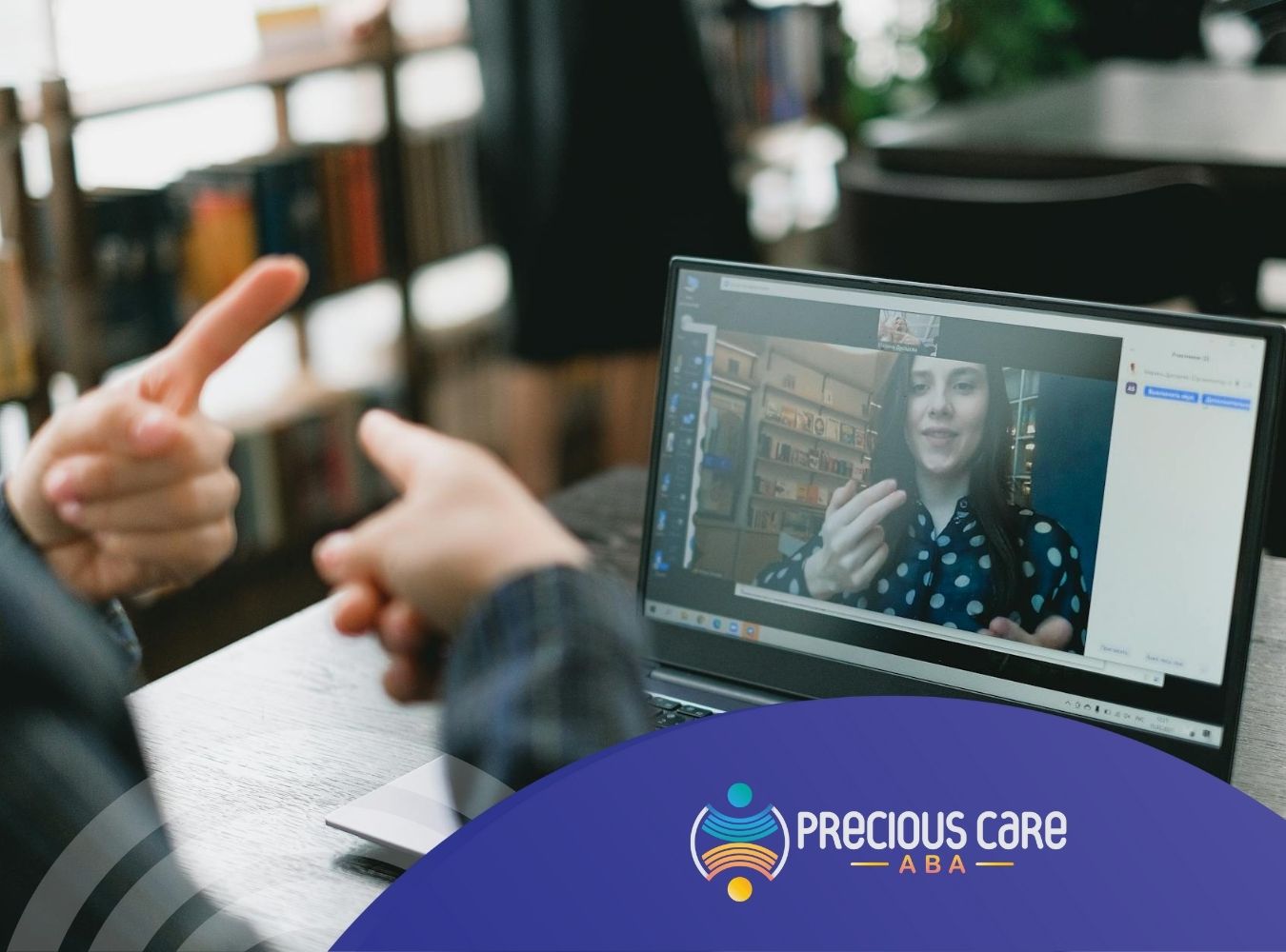 An ABA therapist teaching sign language to a non-verbal autistic child during online ABA therapy.