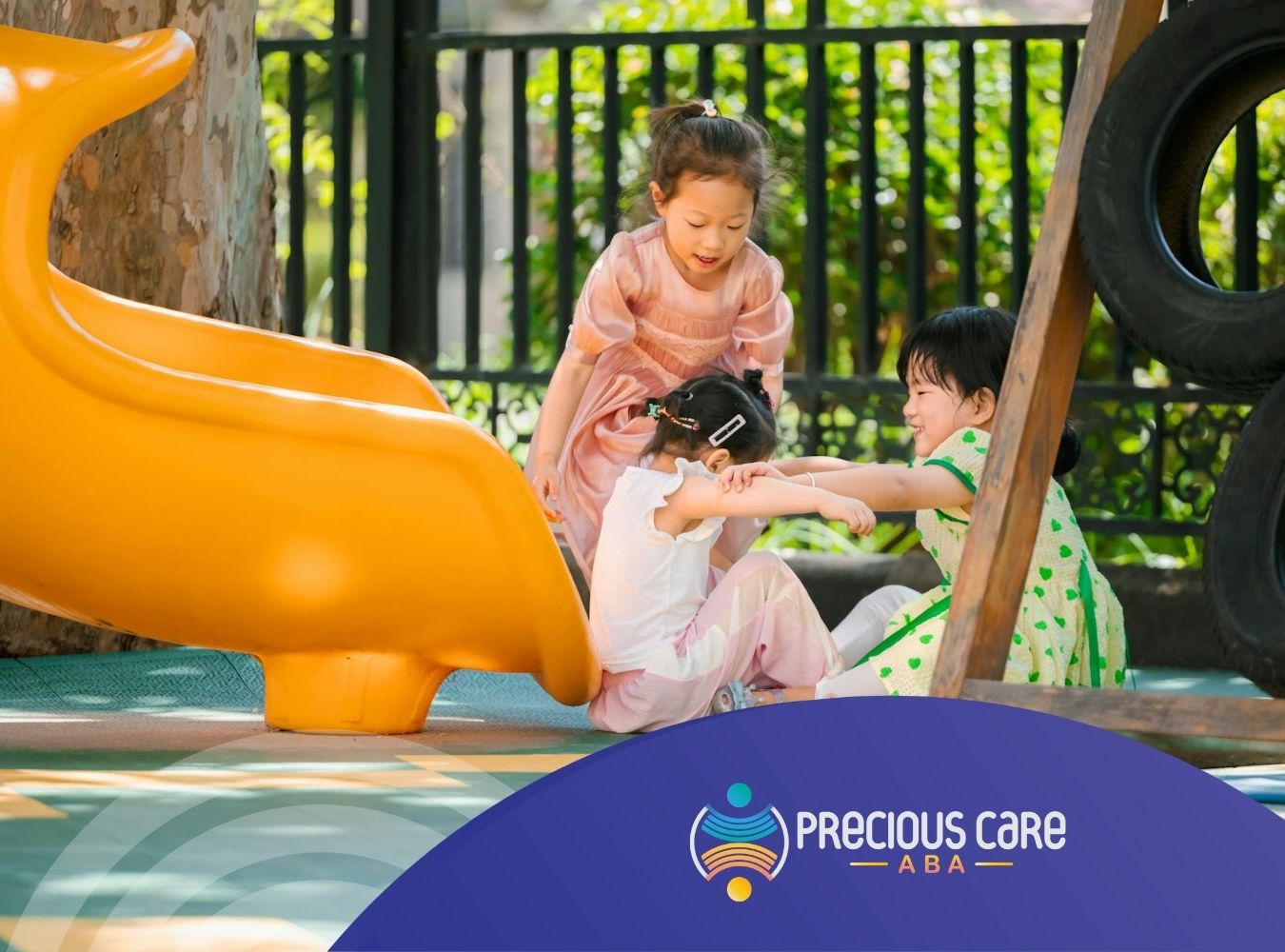 A group of autistic children playing together at a playground during ABA therapy in NJ, with a slide in the background.