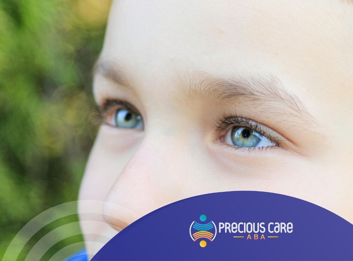 Close-up of a child's blue eyes looking into the distance, set against a blurred green background. The image feels calm and reflective.