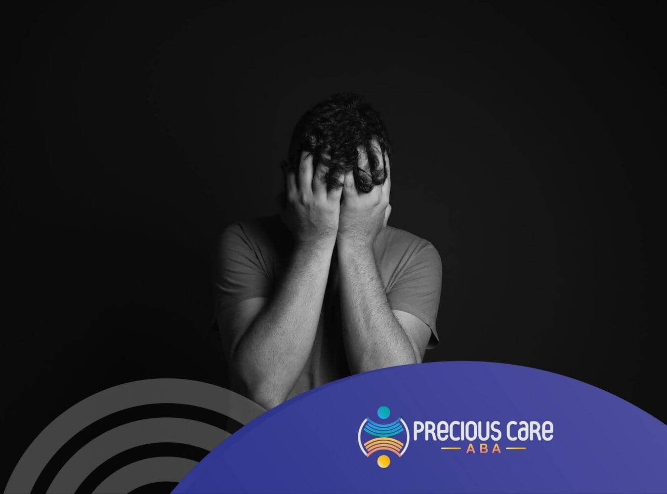 Man with mental problem holding head in hands in a dark room showing stress or frustration in New Jersey