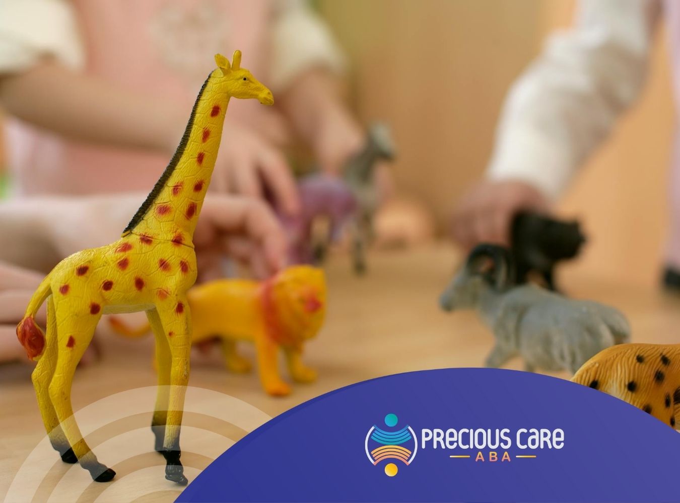 Autistic children playing with colorful animal figurines on a table during daycare-based ABA therapy in Colorado.