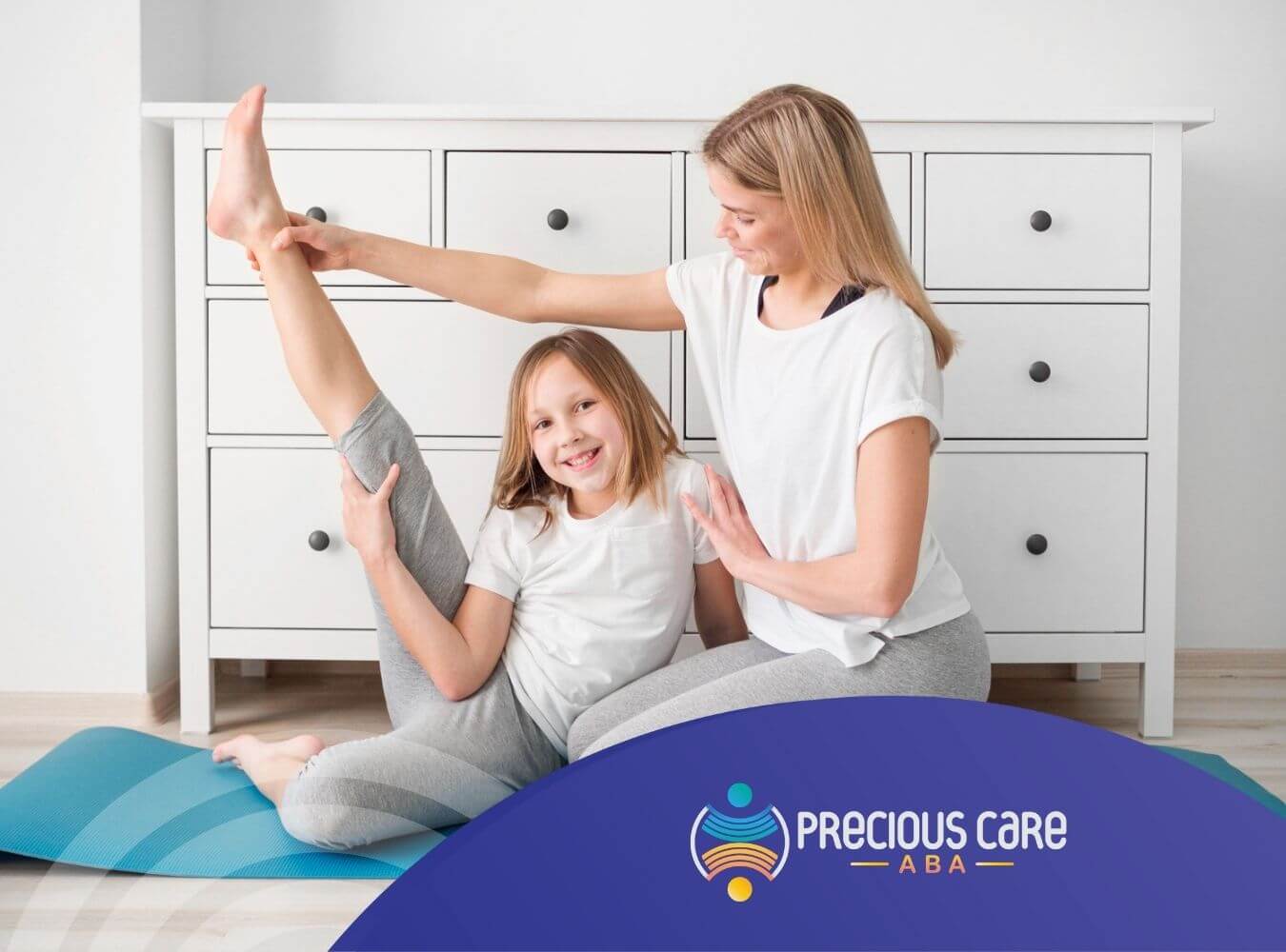 BCBA helping girl with autism stretch on a yoga mat at home during in-home ABA therapy session.